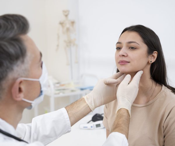 doctor-performing-routine-medical-checkup